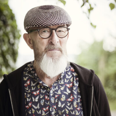 An image of an old man with a beard outdoor