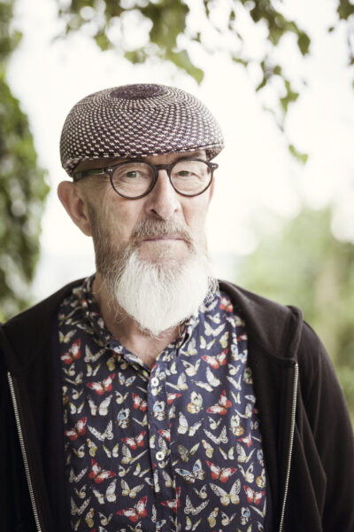 An image of an old man with a beard outdoor